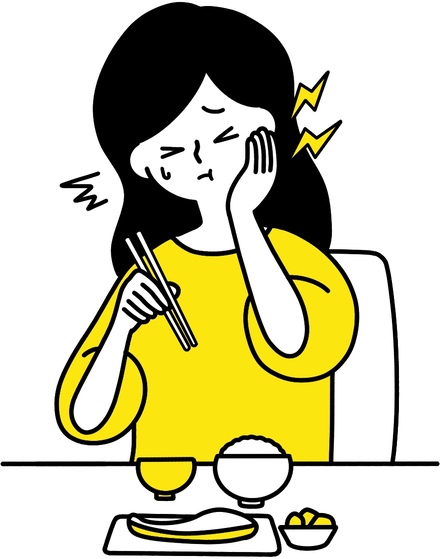 歯痛　ズキっとする　顔を抑える女性　黄色
